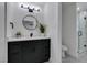 This updated bathroom features a stylish vanity, sleek fixtures, and a modern glass-enclosed shower at 1900 E Oakey Blvd, Las Vegas, NV 89104