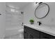 This updated bathroom features a stylish vanity, sleek fixtures, and a modern shower-tub combination at 1900 E Oakey Blvd, Las Vegas, NV 89104