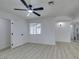 Bedroom features light wood-look flooring, a ceiling fan and access to a bathroom at 1900 E Oakey Blvd, Las Vegas, NV 89104