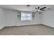Bright carpeted bedroom with a ceiling fan at 1900 E Oakey Blvd, Las Vegas, NV 89104