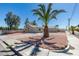 Single-story house with desert landscaping, concrete driveway and mature trees at 1900 E Oakey Blvd, Las Vegas, NV 89104