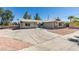 Desert-landscaped single story house with large driveway and well-maintained exterior at 1900 E Oakey Blvd, Las Vegas, NV 89104