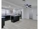 Spacious kitchen with stainless steel appliances, white cabinetry, and a black island at 1900 E Oakey Blvd, Las Vegas, NV 89104
