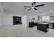 Open-concept kitchen with black island, stainless steel appliances, white cabinets, and sleek countertops at 1900 E Oakey Blvd, Las Vegas, NV 89104