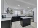 Bright kitchen with island and floating shelves at 1900 E Oakey Blvd, Las Vegas, NV 89104