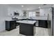 Bright kitchen with island and floating shelves at 1900 E Oakey Blvd, Las Vegas, NV 89104