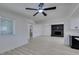 Living room featuring recessed lights, light wood-look flooring and black brick fireplace at 1900 E Oakey Blvd, Las Vegas, NV 89104