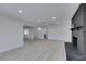 Living room features recessed lights, light wood-look flooring and black brick fireplace at 1900 E Oakey Blvd, Las Vegas, NV 89104