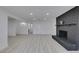 The bright living room has a black brick fireplace and light wood-look flooring at 1900 E Oakey Blvd, Las Vegas, NV 89104