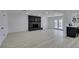 Spacious living room features modern flooring, brick fireplace, and access to the backyard at 1900 E Oakey Blvd, Las Vegas, NV 89104