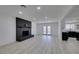 Open-concept living room boasts fireplace, modern floors, and natural light at 1900 E Oakey Blvd, Las Vegas, NV 89104