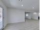 Bright living room features light wood-look flooring and a glass-paneled door at 1900 E Oakey Blvd, Las Vegas, NV 89104