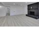 Bright living room features a black brick fireplace and light wood-look flooring at 1900 E Oakey Blvd, Las Vegas, NV 89104