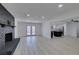 Spacious living room features modern flooring, fireplace, and adjacent kitchen at 1900 E Oakey Blvd, Las Vegas, NV 89104