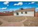 Large backyard with stone landscaping and brick pathway at 2032 Kingswinford Dr, North Las Vegas, NV 89032