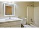 Bathroom featuring a single sink vanity, framed mirror, and a shower-tub combination at 2032 Kingswinford Dr, North Las Vegas, NV 89032
