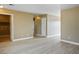 Spacious living room featuring neutral paint, and new flooring at 2032 Kingswinford Dr, North Las Vegas, NV 89032