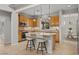 Well-lit kitchen with an island, tiled floors, and stainless steel appliances at 2098 Valley Sand St, Las Vegas, NV 89135