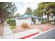 Inviting one-story house with a blue tile roof, situated on a beautifully landscaped lot at 2121 Twickenham Pl # D, Las Vegas, NV 89108