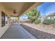 Covered patio with ceiling fan and landscaped backyard at 2148 Shadow Canyon Dr, Henderson, NV 89044