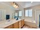 Bathroom featuring double vanity, soaking tub, and walk-in shower at 2148 Shadow Canyon Dr, Henderson, NV 89044