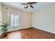 Cozy bedroom with wood floors, ceiling fan and bright window at 2148 Shadow Canyon Dr, Henderson, NV 89044