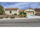 Charming single-story home featuring stucco siding, tile roof, and well-maintained desert landscaping at 2148 Shadow Canyon Dr, Henderson, NV 89044