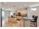 Well-equipped kitchen features an island, granite countertops, stainless steel appliances, and tiled floors at 2148 Shadow Canyon Dr, Henderson, NV 89044