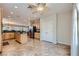 Open kitchen features stainless steel appliances, center island, and neutral color palette at 2148 Shadow Canyon Dr, Henderson, NV 89044