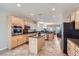 Updated kitchen with granite countertops, stainless steel appliances, a large island, and tiled floors at 2148 Shadow Canyon Dr, Henderson, NV 89044