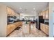 Modern kitchen with stainless steel appliances, granite countertops, an island, and tiled flooring at 2148 Shadow Canyon Dr, Henderson, NV 89044
