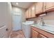 Laundry room with cabinets, sink and washer/dryer at 2148 Shadow Canyon Dr, Henderson, NV 89044