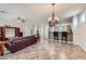 Spacious living room features tiled floors, ample natural light, and is open to the kitchen at 2148 Shadow Canyon Dr, Henderson, NV 89044