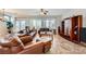 Large living room with tile flooring, neutral walls, modern lighting, and furniture at 2148 Shadow Canyon Dr, Henderson, NV 89044