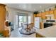 Sunny kitchen with tile floors, a sliding glass door, and ample cabinet space at 2194 King Mesa Dr, Henderson, NV 89012