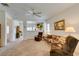 Spacious living area featuring neutral carpet and plenty of natural light at 2194 King Mesa Dr, Henderson, NV 89012