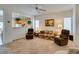 Bright living room featuring neutral carpet, ceiling fan, and lots of natural light at 2194 King Mesa Dr, Henderson, NV 89012