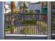 A view from the balcony shows landscaping with palm trees and shops at 2240 Village Walk Dr # 2207, Henderson, NV 89052