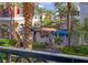 Balcony view shows an outdoor plaza with palm trees, shops, and seating areas at 2240 Village Walk Dr # 2207, Henderson, NV 89052