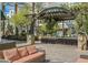 Charming courtyard offers shaded seating areas and lush landscaping at 2240 Village Walk Dr # 2207, Henderson, NV 89052