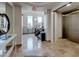 Well-lit hallway with a staircase, elevator access, and tiled floors at 2240 Village Walk Dr # 2207, Henderson, NV 89052