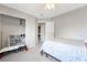 Well-lit bedroom with closet and doorway to the laundry room at 2293 Bull Lake Dr, Henderson, NV 89052