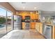 Bright kitchen with stainless steel appliances, and sliding doors that lead to the backyard at 2293 Bull Lake Dr, Henderson, NV 89052