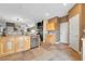 Kitchen area with stainless steel appliances, natural wood cabinets, and tile floors at 2293 Bull Lake Dr, Henderson, NV 89052