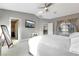 Bright main bedroom featuring ceiling fan, walk-in closet and neutral decor at 2293 Bull Lake Dr, Henderson, NV 89052