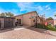 This backyard has a large brick patio, basketball hoop, and playset at 2410 Morocco Ave, North Las Vegas, NV 89031