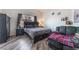 Comfortable bedroom with luxury plank flooring and natural light at 2410 Morocco Ave, North Las Vegas, NV 89031