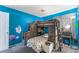 bedroom featuring a bunkbed and colorful wall art, and gray carpet at 2410 Morocco Ave, North Las Vegas, NV 89031