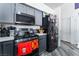 Modern kitchen with gray cabinetry, black appliances, a gas range stove, and ample counter space for cooking at 2410 Morocco Ave, North Las Vegas, NV 89031