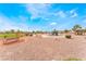 Open park area featuring playground equipment, benches, and natural landscaping at 2410 Morocco Ave, North Las Vegas, NV 89031